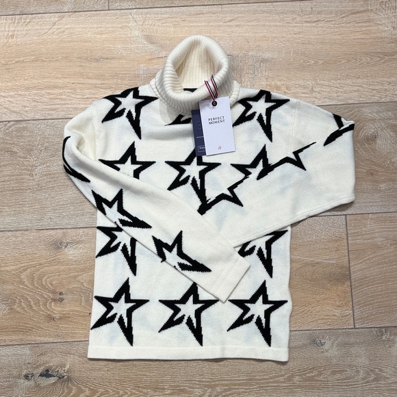 Perfect Moment Sweaters - Perfect Moment Cream Turtleneck Sweater with Black Star Pattern